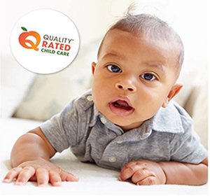 Photo of a baby with the Quality Rated Child Care logo on it